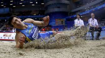 Atlet lompat jauh Ukraina Oleksiy Kasyanov di Kejuaraan Atletik Dunia di ERGO Arena, Sopot, Polandia, Jumat (7/3/2014). (Reuters/ Kai Pfaffenbach)