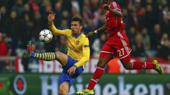 Bayern Munich lolos ke perempat final Liga Champions usai menahan imbang Arsenal 1-1 di Allianz Arena, Rabu (12/3). Bayern menang dengan agregat 3-1. [Reuters/Kai Pfaffenbach]