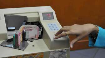 Foto: Rupiah Kembali ke Posisi Rp11.400