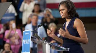 Pamer Otot Perut, Michelle Obama Ajak Wanita untuk Tidak Lupa Merawat Diri