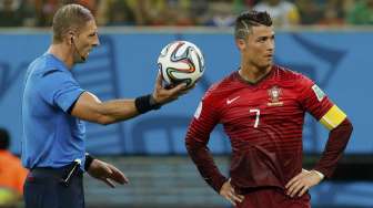 Reaksi Cristiano Ronaldo saat menghadapi Amerika Serikat, di Amazonia, Manaus, Minggu (22/6). [Reuters/Siphiwe Sibeko] 