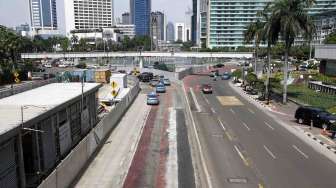 Suasana lengang pada hari pencoblosan pilpres di sekitar Jalan Sudirman - Thamrin Jakarta, Rabu (9/7). [suara.com/Adrian Mahakam]