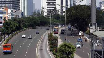 Suasana lengang pada hari pencoblosan pilpres di sekitar Jalan Sudirman - Thamrin Jakarta, Rabu (9/7). [suara.com/Adrian Mahakam]