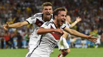 Mario Goetze usai membobol gawang Argentina dalam Final Piala Dunia 2014 di stadion Maracana Stadium di Rio de Janeiro, Brazil, Minggu (13/7). [Reuters/Kai Pfaffenbach] 