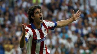 Pemain Atletico Madrid Tiago merayakan gol pembuka ke gawang Real Madrid. (REUTERS/Sergio Perez)