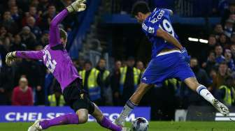 Chelsea memastikan lolos ke final Piala Liga Inggris setelah di semifinal mengalahkan Liverpool 1-0 di Stamford Bridge, Rabu (28/1). [Reuters/Eddie Keogh]