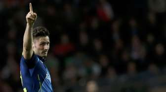 Pemain Arsenal Olivier Giroud rayakan gol ke gawang Monaco (18/3) [Reuters/Jean-Paul Pelissier]