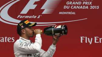 Pebalap Mercedes asal Inggris, Lewis Hamilton menjuarai GP Kanada, (7/6). [Reuters/Chris Wattie]