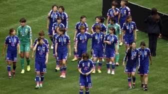 Reaksi pemain Jepang usai menerima medali perak di Piala Dunia Wanita (6/7) [Reuters]