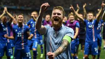 Para pemain Islandia merayakan kemenangan mereka atas Inggris di perdelapan final Euro 2016 di Nice, Prancis, Senin (27/6/2016). [Bertrand Langlois/AFP]