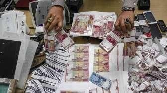 Pengungkapan Sindikat Pengedar Uang Palsu