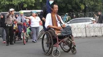 Menagih janji kepada Jokowi untuk memenuhi hak-hak disabilitas,