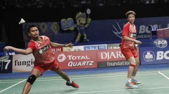 Pasangan Tontowi-Liliyana berhasil melaju ke babak semifinal usai menang 21-18 21-16. [suara.com/Kurniawan Mas'ud]