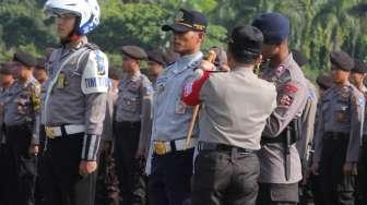 Kapolri Jenderal Tito Karnavian saat pelaksanaan apel gelar pasukan Operasi Ramadniya 2017 di lapangan Silang Monas, Jakarta, Senin (19/6/2017). [Suara.com/Oke Atmaja]