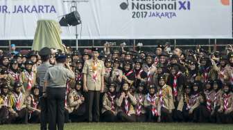 Presiden Joko Widodo bersama Ibu Negara Iriana Joko Widodo acara Raimuna Nasional XI yang bertepatan dengan peringatan ulang tahun Pramuka ke-56 di, Bumi Perkemahan Cibubur, Jakarta, Senin (14/8).