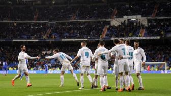 

Para pemain Real Madrid merayakan gol Cristiano Ronaldo ke gawang Getafe. PIERRE-PHILIPPE MARCOU / AFP