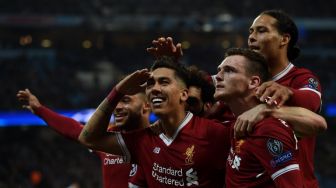 Pemain Liverpool Roberto Firmino rayakan golnya ke gawang City [AFP]