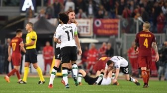 Reaksi pemain Liverpool dan AS Roma usai dalam pertandingan leg kedua semifinal Liga Champions yang berlangsung di Stadio Olimpico, Kamis (3/5/2018) [AFP]