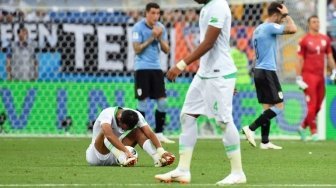 Reaksi pemain Arab Saudi Abdullah Otayf setelah timnya dikalahkan Uruguay di Rostov Arena, Rabu (20/6/2018) [AFP]