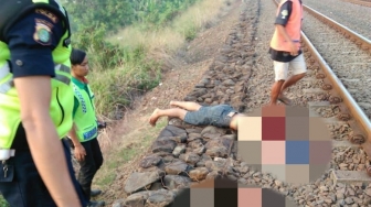 Tidur di Rel, Kepala dan Tangan Hilam Putus Terlindas Kereta