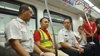 Gubernur DKI Jakarta Anies Baswedan memantau uji coba dan mengecek Light Rapid Transit (LRT)  yang telah diujicoba sejak 21 Agustus di Stasiun Velodrome, Jakarta