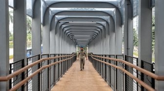 Peresmiaan JPO gelora di kawasan Gelora Bung Karno, Jakarta, Kamis (28/2). [Suara.com/Muhaimin A Untung]