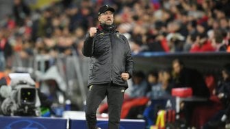 Ekspresi pelatih Liverpool Jurgen Klopp saat merayakan kemenangan timnya atas Bayern Munchen di Allianz Arena, Munich, Jerman, Kamis (14/3) dini hari WIB. [Christof STACHE / AFP]