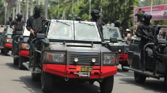 Prajurit SAT-81 Gultor Kopassus saat parade Pemberangkatan Patroli Skala Besar TNI-Polri di JIExpo, Kemayoran, Jakarta Pusat, Minggu (14/4). [Suara.com/Muhaimin A Untung}