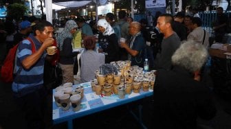 Suasana acara buka puasa bersama Pewarta Foto Indonesia Jakarta di kawasan Bundaran HI, Jakarta, Jumat (18/5). [Foto/Dok PFIJ]