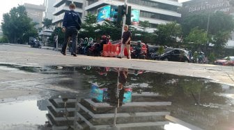 Suasana di Jalan MH Thamrin, Jakarta, Selasa (28/5). [Suara.com/Oke Atmaja]