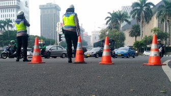 Suasana di Jalan Merdeka Barat, Jakarta, Jumat (14/6). [Suara.com/Oke Atmaja]