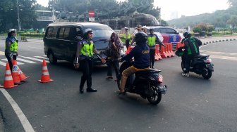 Suasana di Jalan Merdeka Barat, Jakarta, Jumat (14/6). [Suara.com/Oke Atmaja]