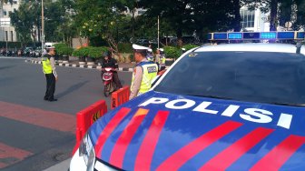 Suasana di Jalan Merdeka Barat, Jakarta, Jumat (14/6). [Suara.com/Oke Atmaja]