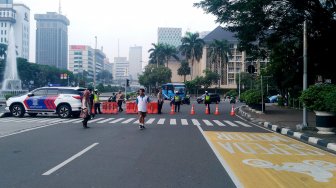 Suasana di Jalan Merdeka Barat, Jakarta, Jumat (14/6). [Suara.com/Oke Atmaja]