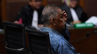 Ekspresi Wajah Eks Dirut PLN Sofyan Basir Saat Jalani Sidang Dakwaan