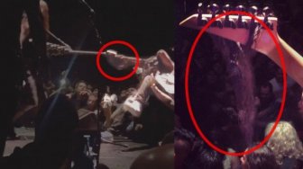 Terlalu Rusuh Saat Menonton Konser, Rambut Penonton Ini Tersangkut di Gitar