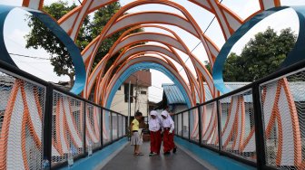 Jembatan Penyeberangan Orang (JPO) Ketupat di Jalan Gajah Mada, Gambir, Jakarta, Selasa (30/7). [Suara.com/Arief Hermawan P]