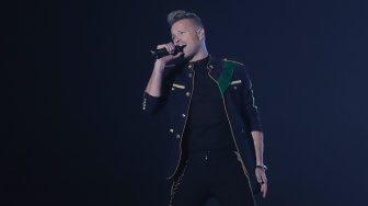 Personil boyband Westlife saat menghibur para penggemarnya di ICE BSD, Tangerang, Banten, Selasa (6/8). [Suara.com/Arya Manggala] 