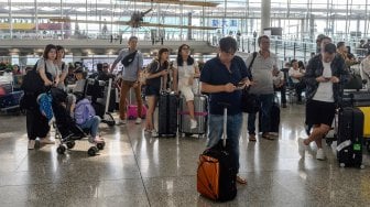 Suasana di Bandara Internasional Hong Kong, Cina, Selasa (13/8). [Philip FONG / AFP]
