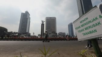 Suasana di kawasan Budaran Hotel Indonesia, Jakarta, Minggu (20/10). [Suara.com/Angga Budhiyanto]