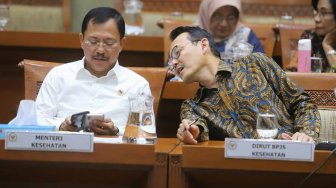 Menteri Kesehatan Terawan Agus Putranto dan Direktur Utama BPJS Kesehatan Fachmi Idris saat menghadiri Rapat Dengar Pendapat di Komisi IX DPR, Kompleks Parlemen, Jakarta, Selasa (5/11). [Suara.com/Arya Manggala]