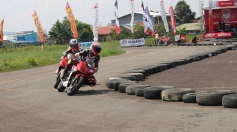 Honda Dream Cup (HDC) seri Samarinda digelar di Sirkuit Ex Bandara Temindung, Kota Samarinda, Kalimantan Timur, Minggu (10/11/2019). [Suara.com/Syaiful Rachman]