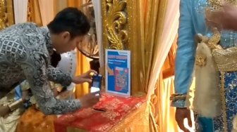 Unik, Sumbangan Pesta Pernikahan Ini Pakai Aplikasi Pembayaran Non Tunai