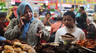 Suasana Festival Sumarak Minangkabau 2019 di Blok M Square, Jakarta Selatan, Sabtu (14/12). [Suara.com/ Alfian Winanto]