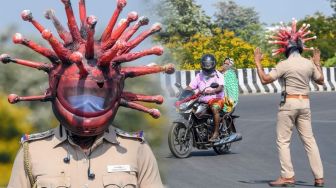 Saat Polisi India Usir Warga di Luar Rumah Pakai Helm 'Corona'