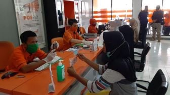 PT Pos Distribusikan Bantuan Sosial Tunai Ke Masyarakat Terdampak Covid-19