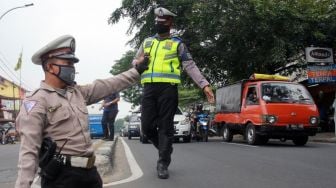 Sosok Ahmad Junaidi, Pengatur Lalu Lintas Difabel Berseragam Polisi