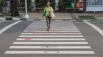 Coretan Vandal Aksi Tolak Omnibus Law Belum Terhapus