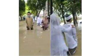 Ngebet Nikah, Pasangan Calon Pengantin Terjang Banjir Menuju KUA