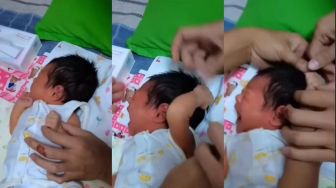Viral Bayi Kejer Jambak Rambut Sendiri, Warganet: Udah Pinter Drama Ya